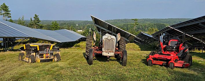 Mowing equipment parked on a solar field.